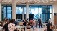 people walking through information centre