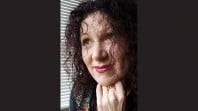 Cropped image with black background of young Indigenous author Jane Harrison