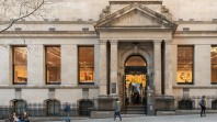 Russell Street library entrance with porticoed entry and illuminated windows