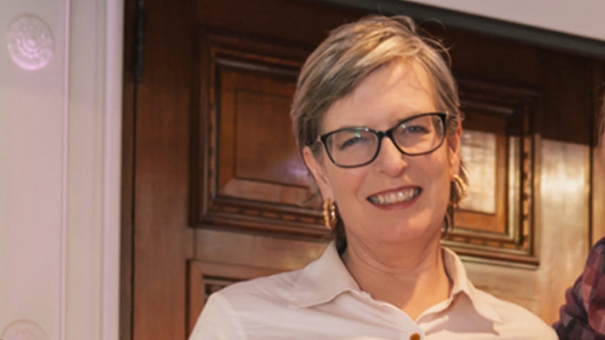 portrait of smiling woman with glasses