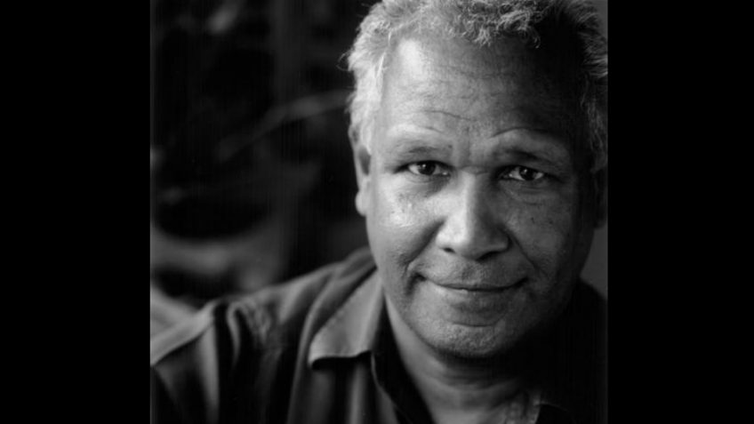 Black and white photo of a man smiling