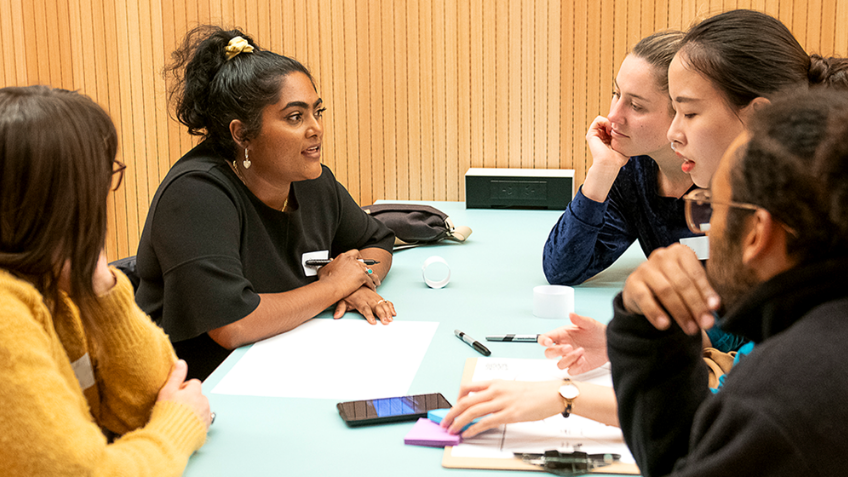 A group of students from around the world discuss a technical problem at the Future Founders Festival