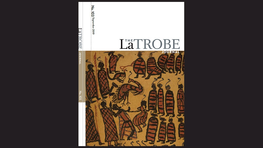 black background with journal cover with Aboriginal artwork