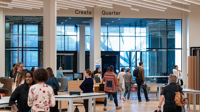 people walking through information centre