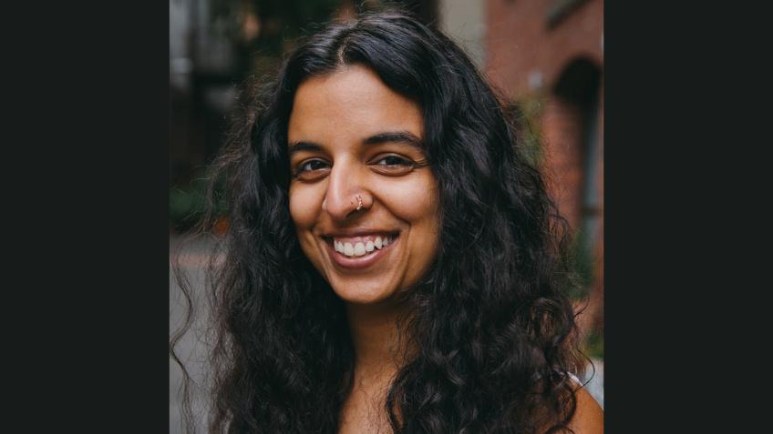 Woman smiling directly at camera