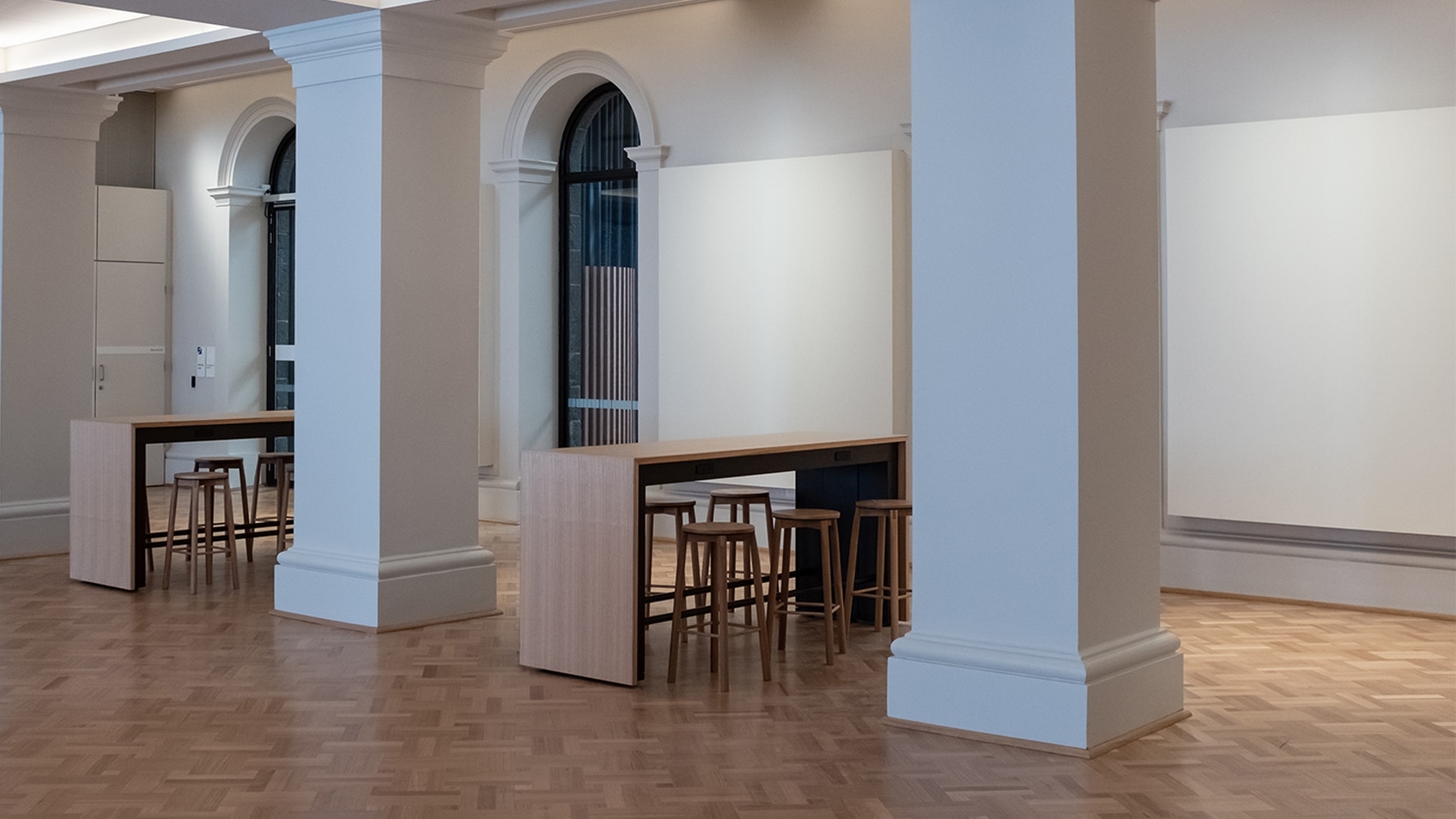 hall with pillars and parquetry floor