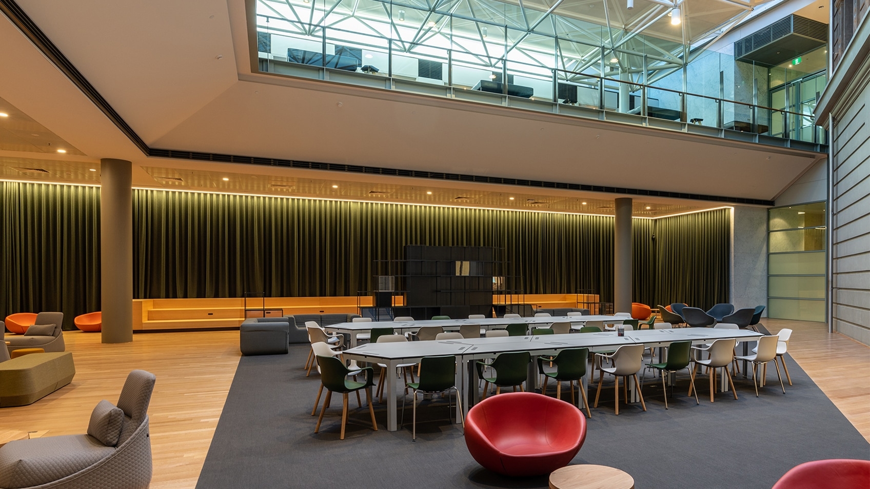 empty workspace with long tables and mezzanine floor