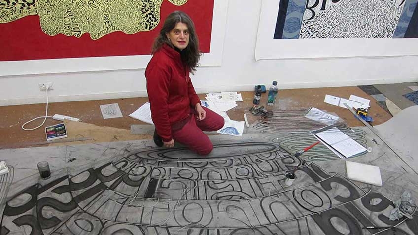 Photo of Angela Cavalieri, artist in studio, with work in progress Amore, 2013