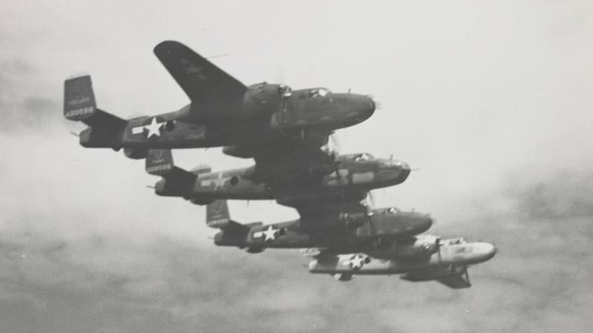 Four B17 bombers in flight during World War II, probably near Borneo