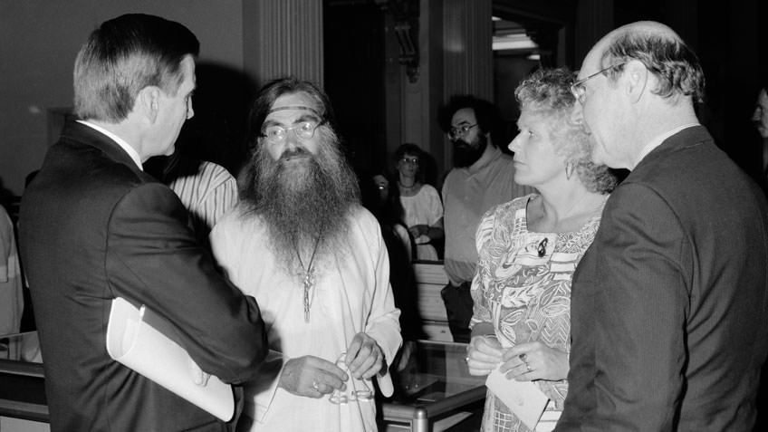 Handover ceremony for the Ken Pound Collection in Queen's Hall, State Library of Victoria, 1994. In the foreground, L to R: Premier Jeff Kennett; Ken Pound; Helen Tait, CEO State Library of Victoria; the Hon Hadden Storey, Minister for the Arts