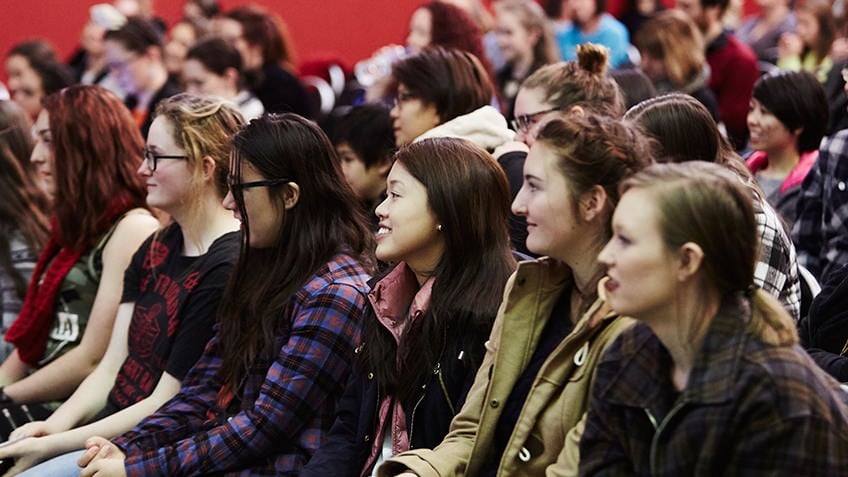 Colour shot of an audience of teenaged girls