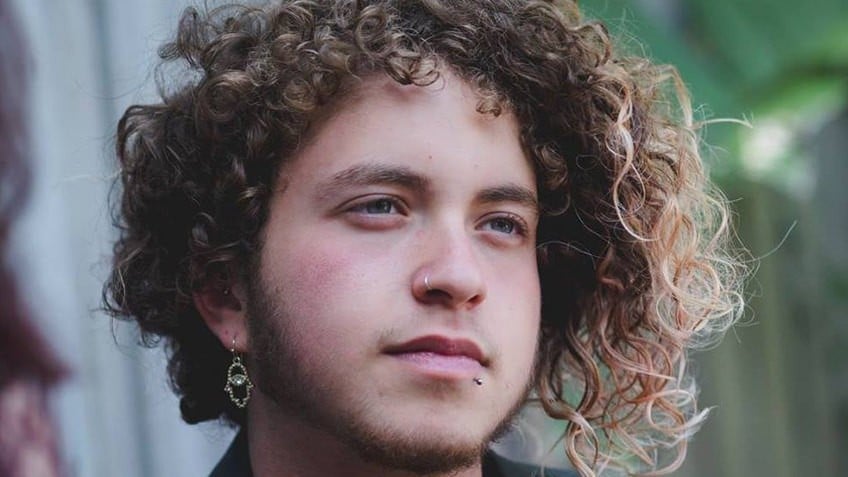 Head shot of transgender author Nevo Zisin