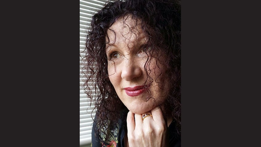 Cropped image with black background of young Indigenous author Jane Harrison