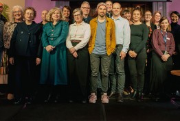 group shot of library fellows standing on a stage