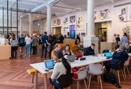 Library Russell Street foyer with cafe customers, whie pillars and people at desks