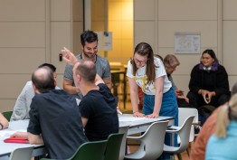 people working at a long table