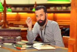 Photo of Nicholas Jones seated in the La Trobe Reading Room