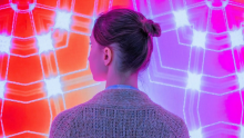 Curious women in front of glowing pink and red background 