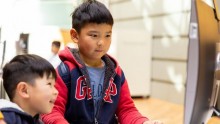 Two children at computer 