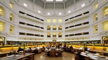 People sitting at desks in the La Trobe reading room