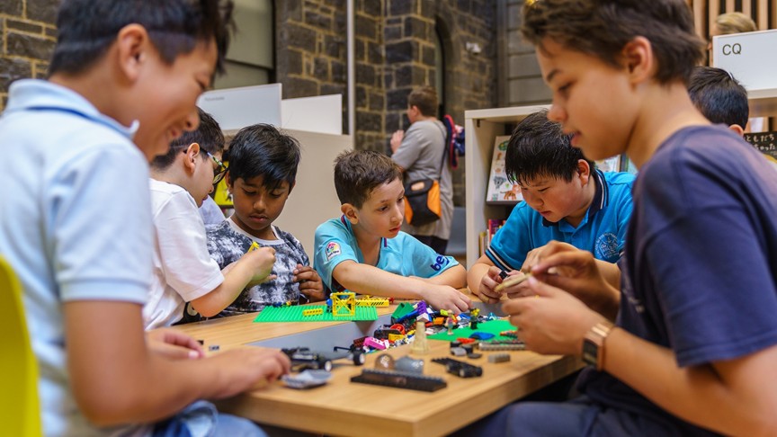 children making and creating at tables